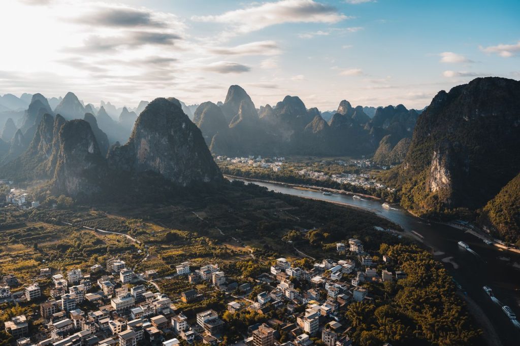 Discover the breathtaking aerial view of karst mountains and lush countryside in Guilin, Guangxi, China.