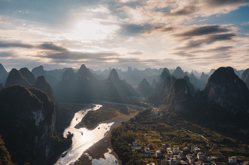 Stunning aerial view of the Li River and karst mountains in Guilin, Guangxi, China at sunset.